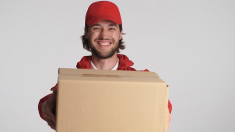 Caucasian-delivery-man-in-front-of-camera-on-white-background.