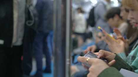 commuters on smartphones