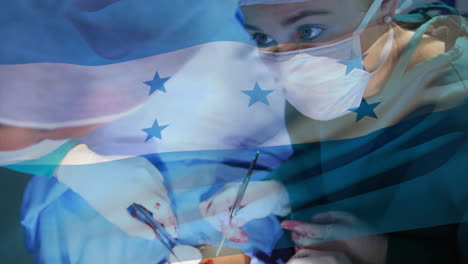 animation of flag of honduras over surgeons in operating theatre