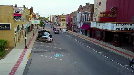 a rising aerial over a main street in small town usa