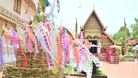 lanna flag decoration for sand pagoda blowing by the wind in wat phra singh temple in chiang rai province of thailand.