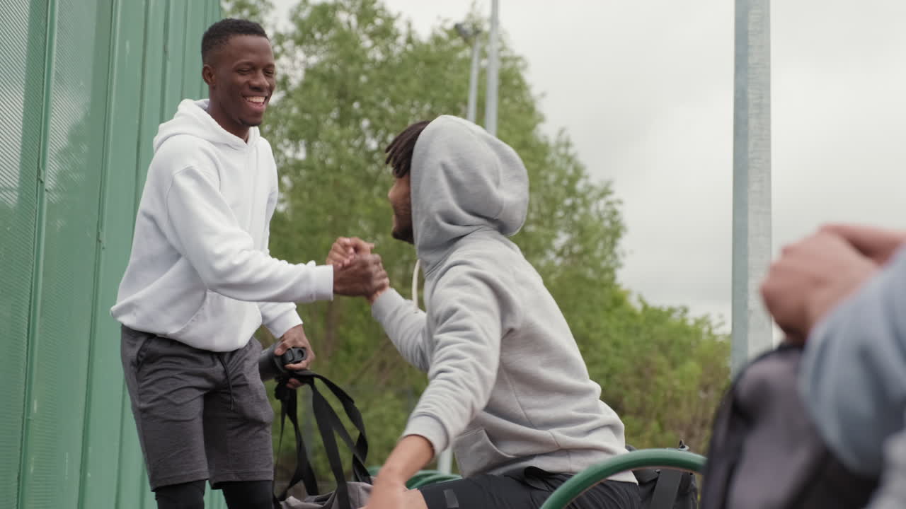 Friends greeting each other outdoors