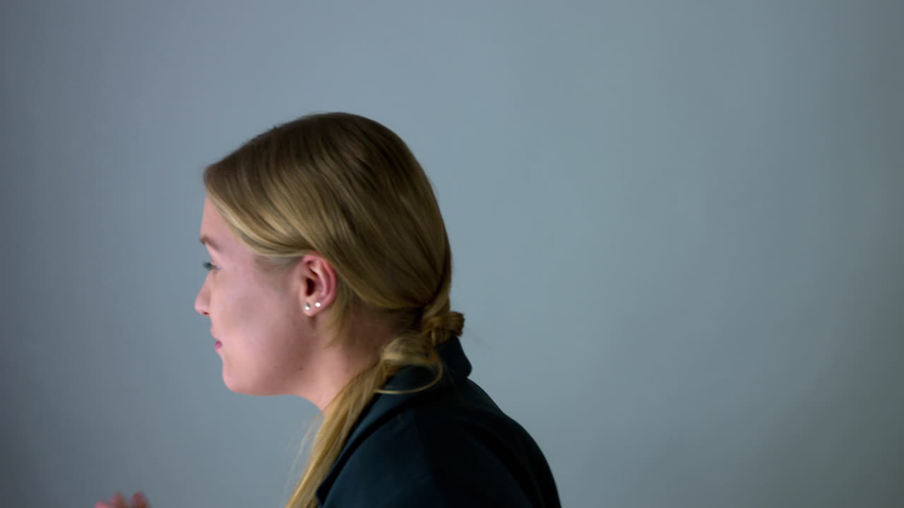 A happy business woman celebrating her success and victory by dancing and laughing