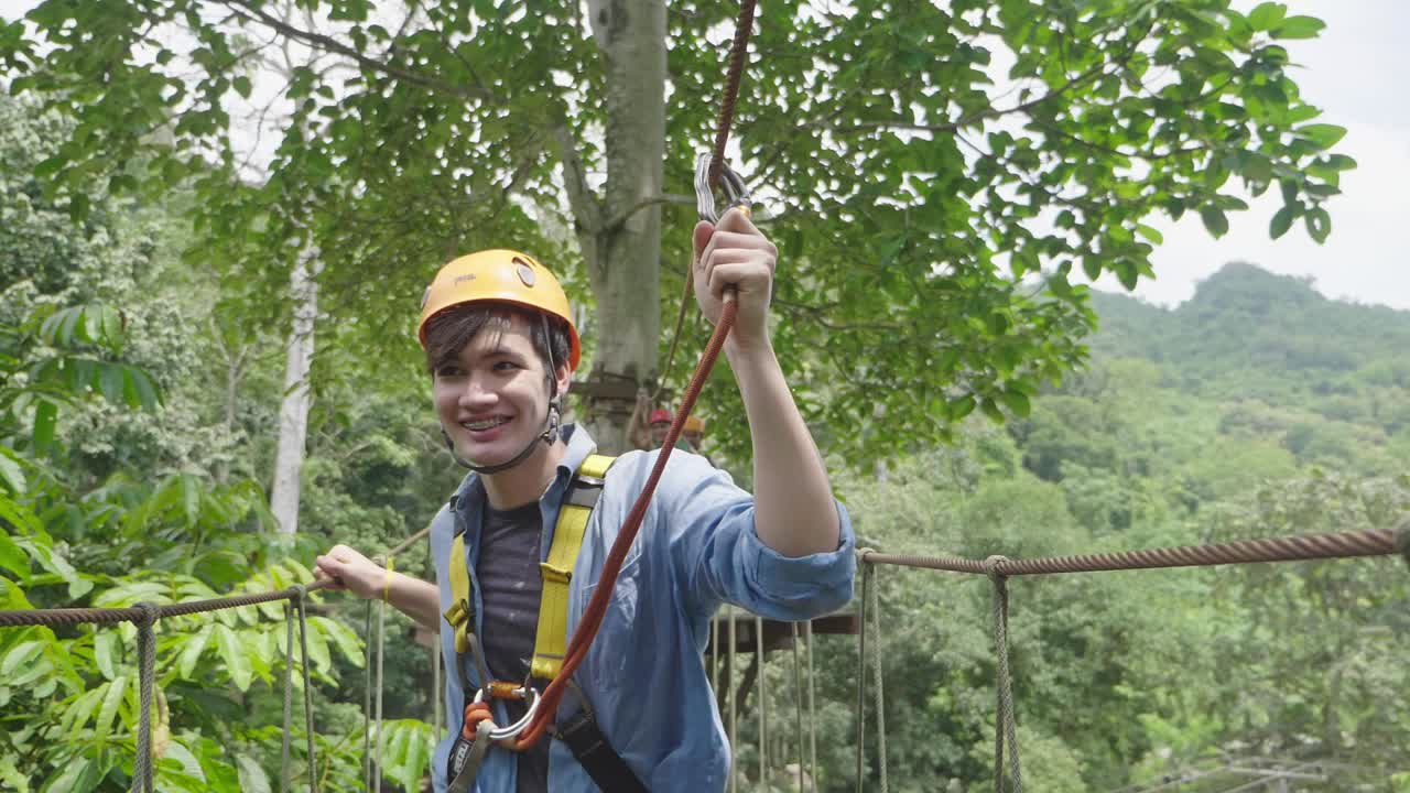 Happy Man On Rope Bridge At Adventure Park