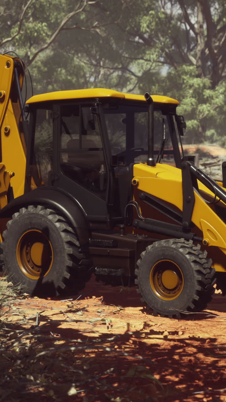 excavadora amarilla en un claro del bosque