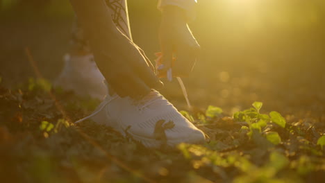 Woman tying her shoelaces in autumn