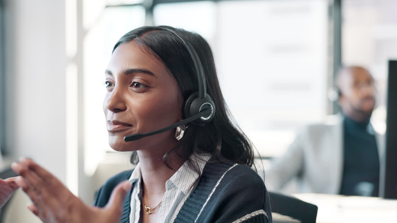 Customer service representative wearing headset in office