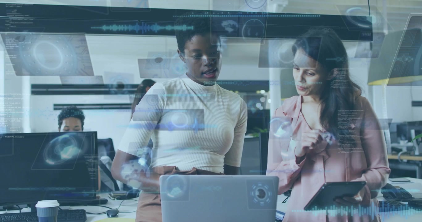 data layer fading, analyst using laptop and manager tapping tablet, charts floating analyzing data