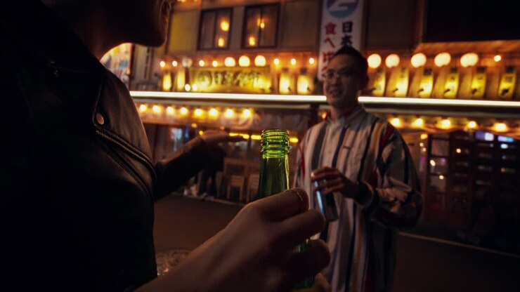 Friends enjoying drinks at a bar at night