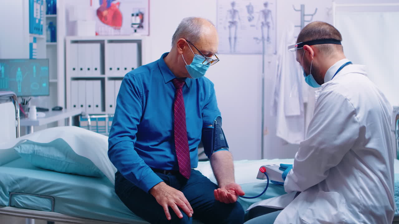 Checking blood pressure to old man