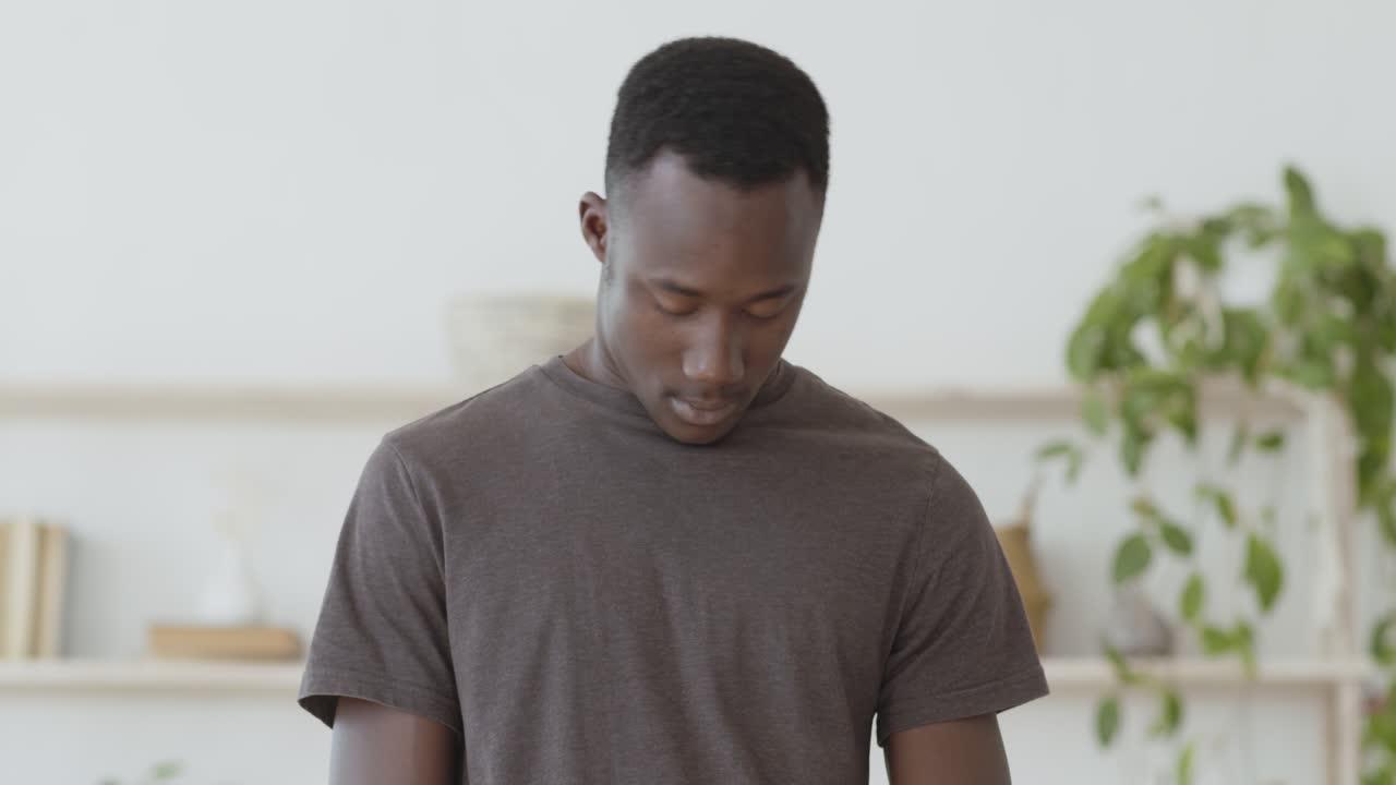 Man Stretching and Relaxing at Home