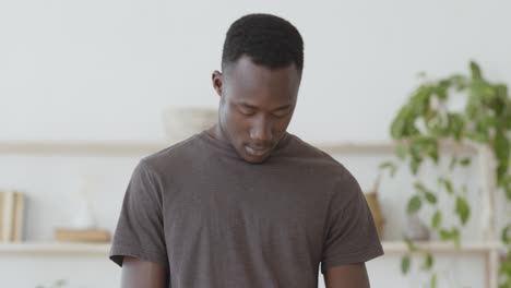man stretching and relaxing at home