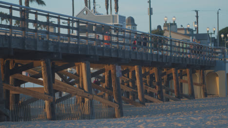 seal beach pier with orange light and shadows