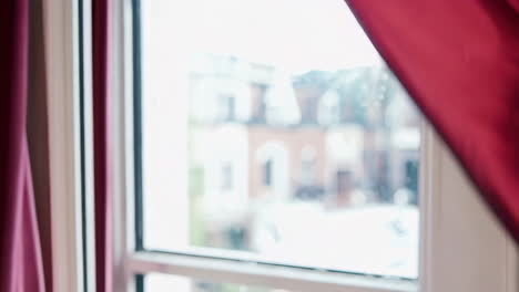 red curtains at a window