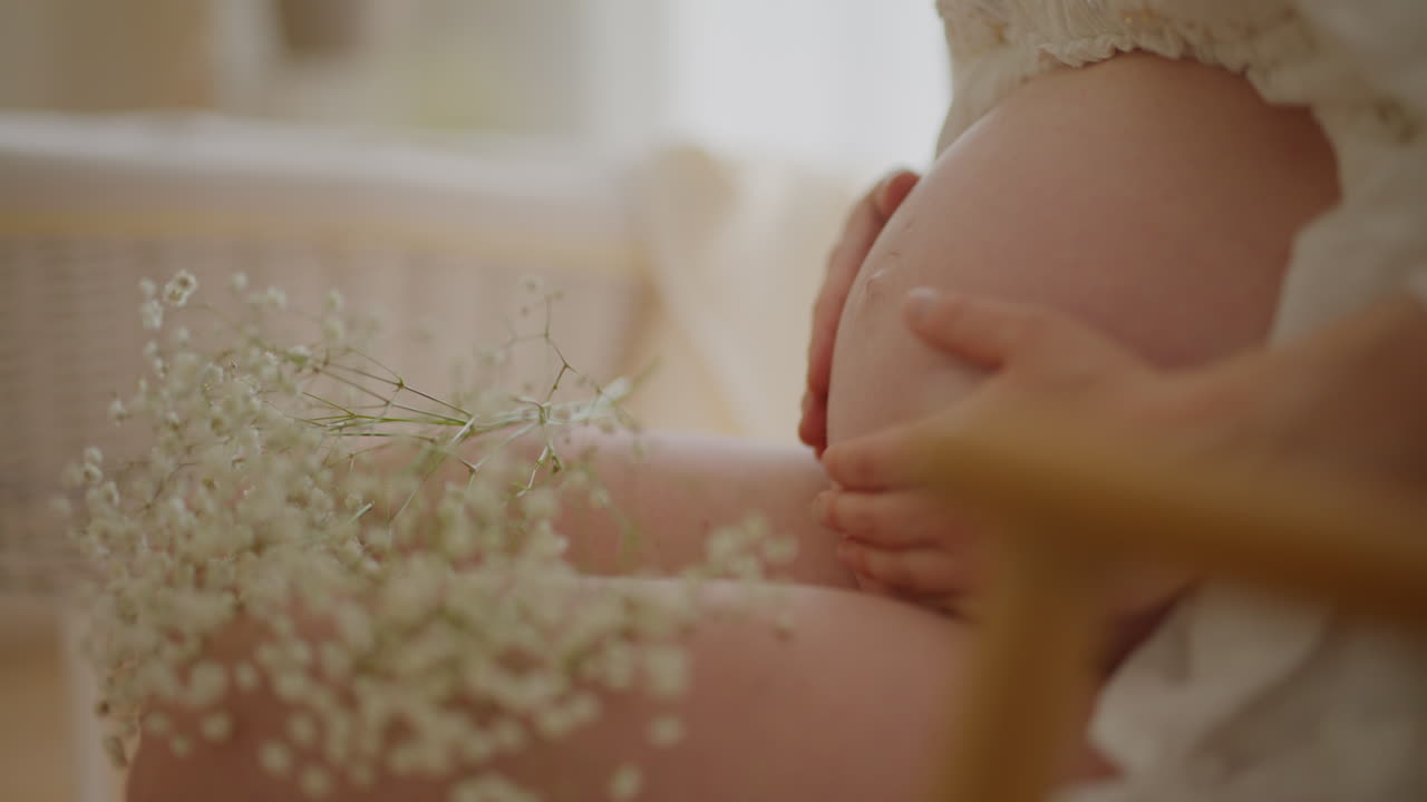 Pregnant Woman Touching Belly Preparing for Childbirth