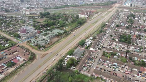 Aerial-View-of-Modern-Residential-Building-in-Kibera-Neighborhood-Next-by-Slums-of-Nairobi,-Kenya,-60fps-Drone-Shot