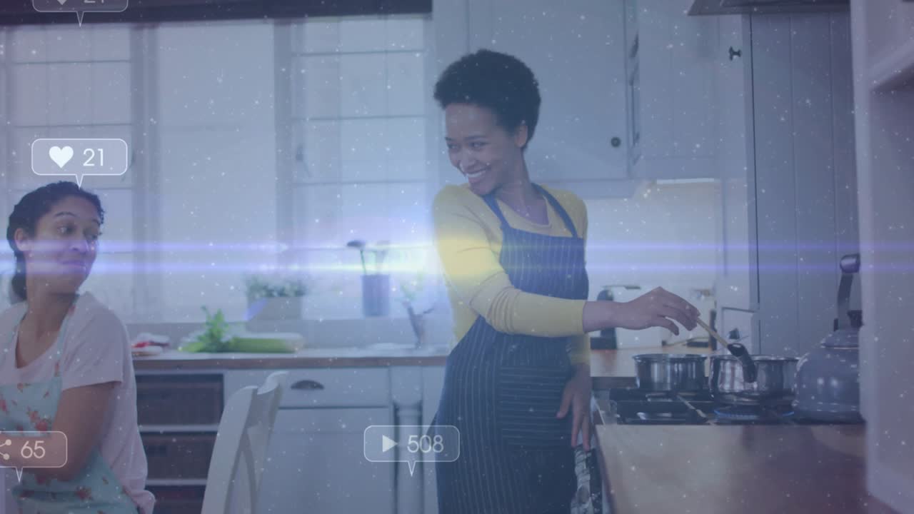 Home cook stirring food at stove sharing cooking livestream causing icons drifting friend observing