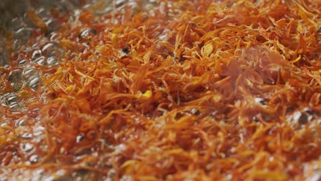 closeup of edible flowers cooking