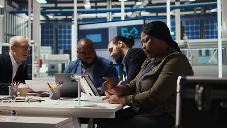 sustainability department team compiling reports on solar panel plant emissions