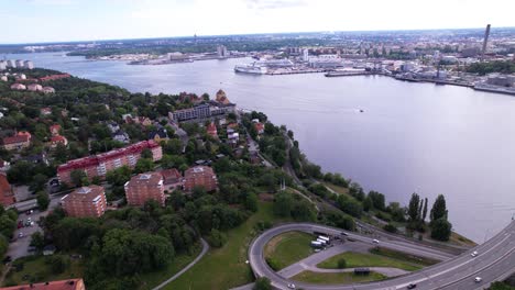 aerial view of an urban waterfront with a bridge and port