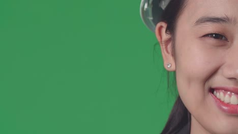 smiling woman engineer on green screen