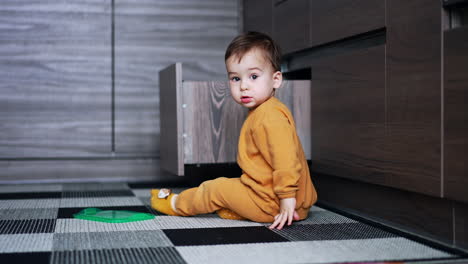 toddler playing in the kitchen