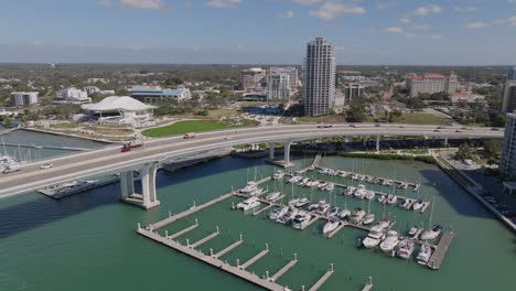 drone flight over downtown clearwater causeway byway bridge overlooking coachman park, and marina