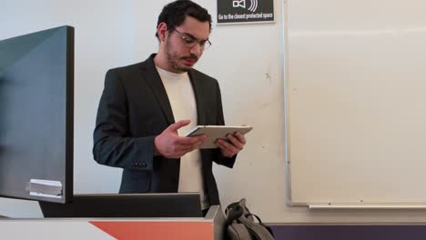 young speaker engaging audience with tablet