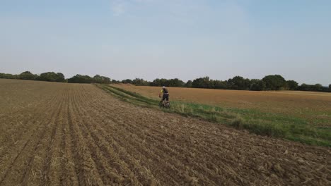 Mountain-biker-riding-on-track-drone-tracking-low-and-fast