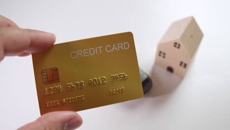 close-up of a mockup credit card that could be used for financing a car or a housing loan to acquire some personal assets