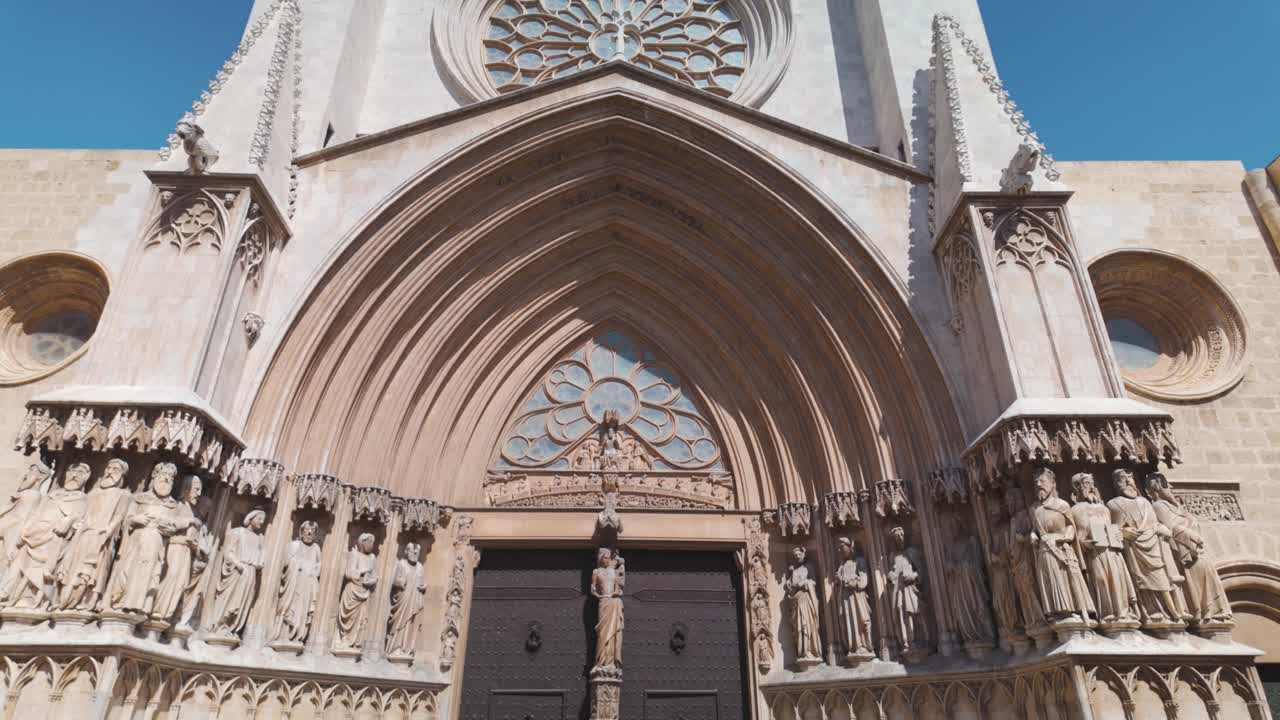 Gothic cathedral entrance with ornate stone carvings in Tarragona, Spain