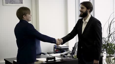 businessmen handshake in office