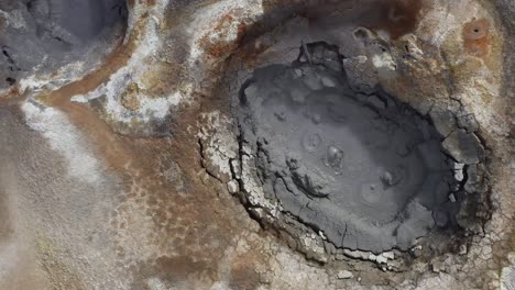 famous mud pools with gurgling boiling bubbles from underground heat source