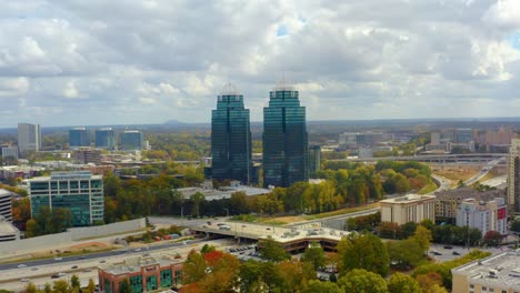 aerial drone shot flying past the king and queen towers in atlanta georgia