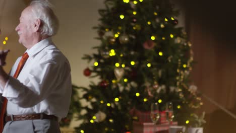 Loving-Senior-Couple-Dancing-Togheter-At-Home-On-Christmas