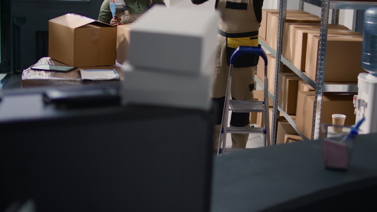 Warehouse workers packaging boxes