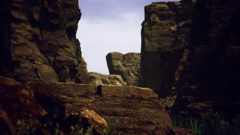 dramatic rock formations contrast against a clear sky in rugged terrain