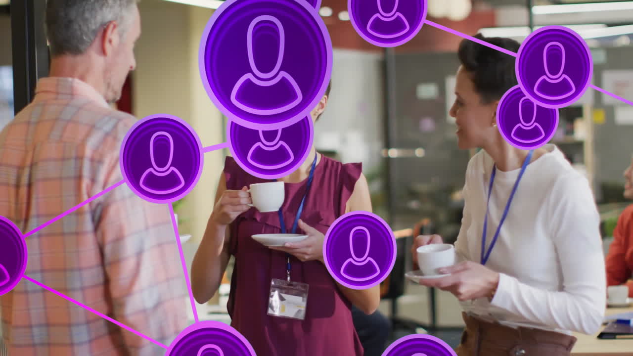 Three professionals business networking over coffee in office, showing purple social network icons