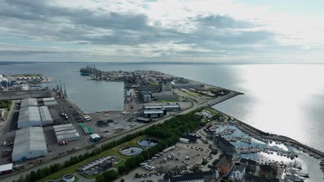 aarhus container terminal and port for molslinjen ferry company - sunrise aerial showing harbor area in aarhus denmark