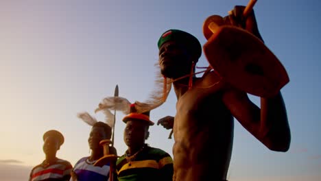 traditional african warriors getting ready to hunt in karamoja, uganda, africa - close up