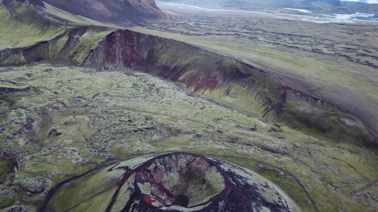 Crater of Inactive Volcano in Highlands of Iceland, Tilt Up Aerial View Revealing Lava Valley Skyline