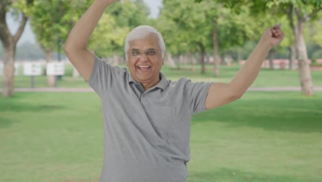 Happy-Indian-old-man-dancing-and-enjoying-in-park