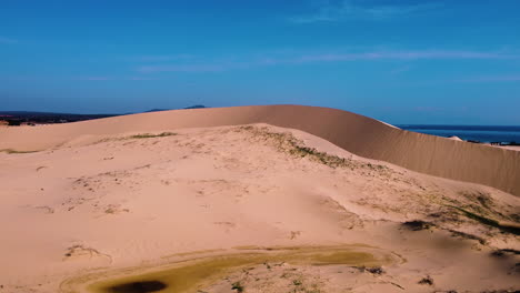 slow aerial flying forward over sand dunes in mui dinh, vietnam