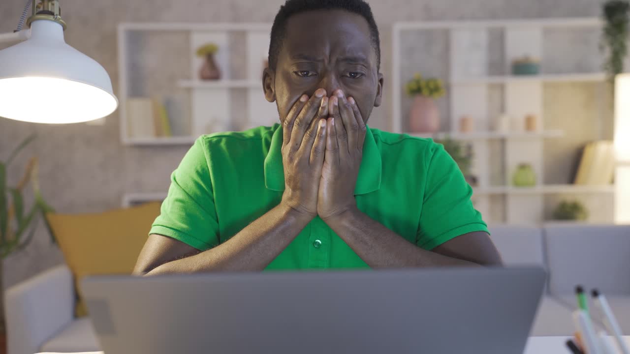 Frustrated young black man becomes desperate and brooding.