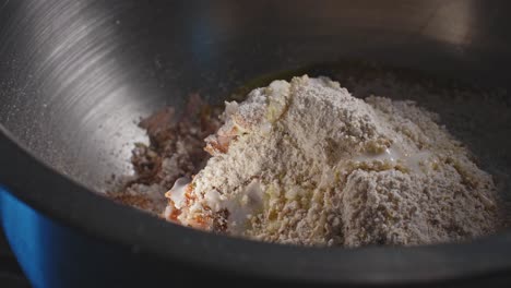 Close-up-of-skilled-chef-preparing-tuna-fritters