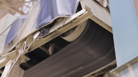 low angle view of black conveyor belt rotate in factory, czech republic