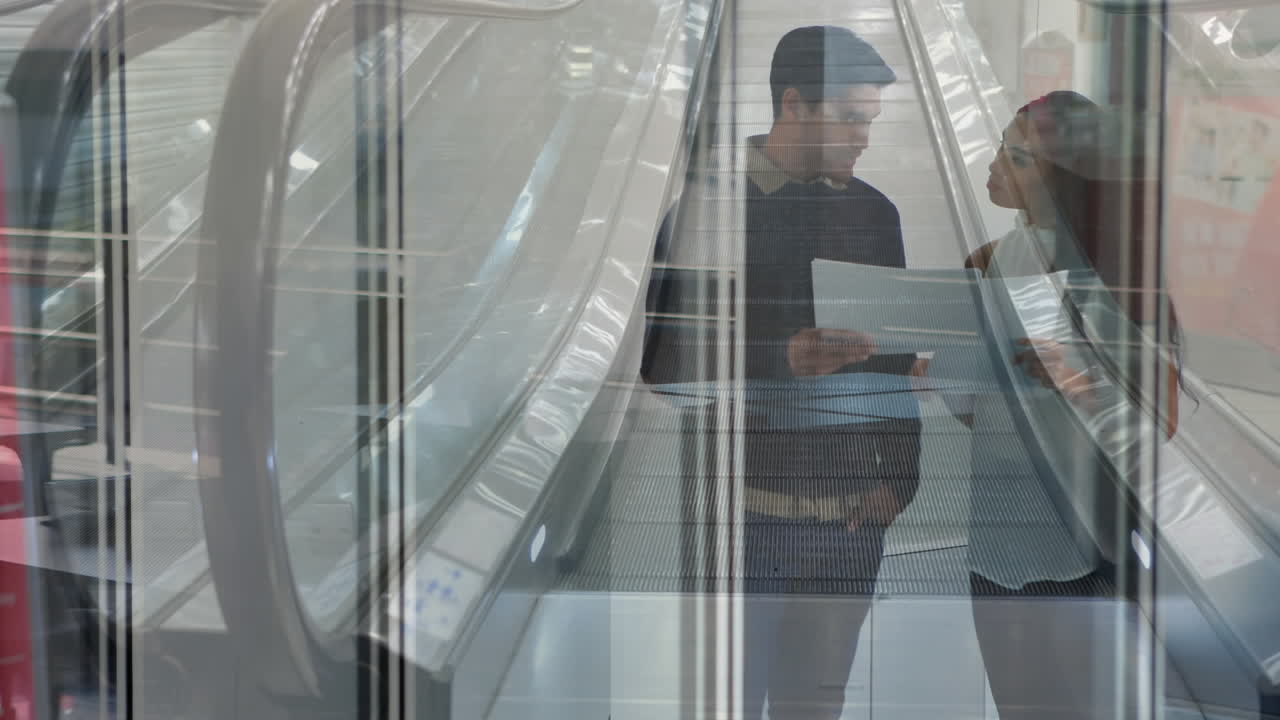 Animation of escalator over business people talking in modern office