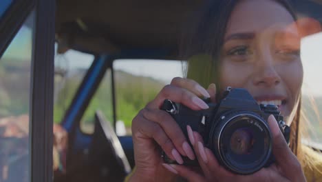 Young-woman-on-a-road-trip-in-pick-up-truck