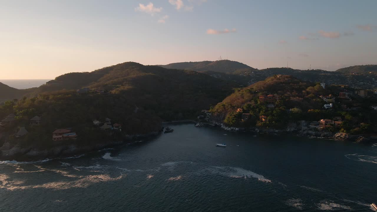 Panoramic aerial view over the beach of ixtapa zihuatanejo, sunset, cinematic 4k