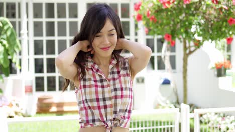 pretty young woman in a tropical garden